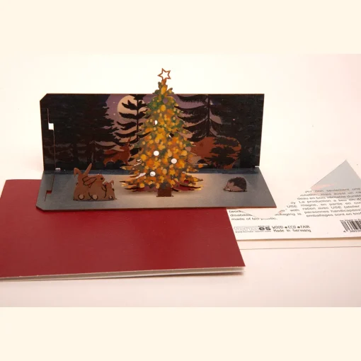 Waschbär Pop Up-Holzpostkarte »Weihnachten im Wald«.
